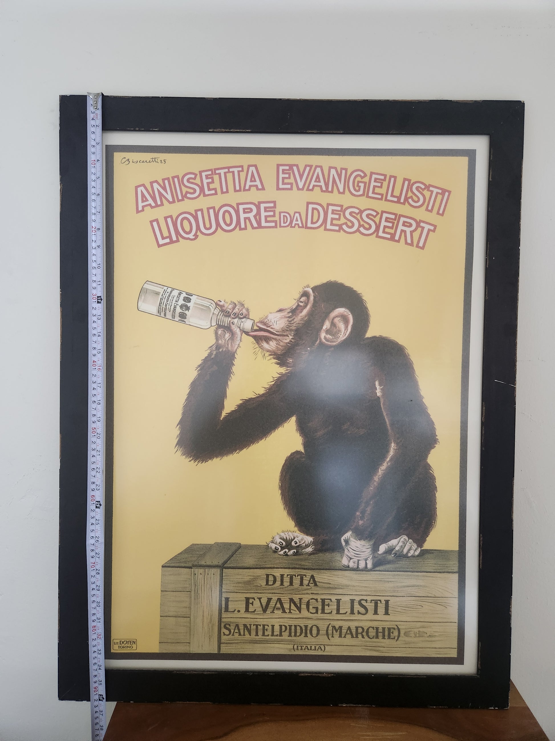 Anisetta Evangelisti drinking monkey poster after Carlo Biscaretti, framed reproduction, shown with tape measure for height