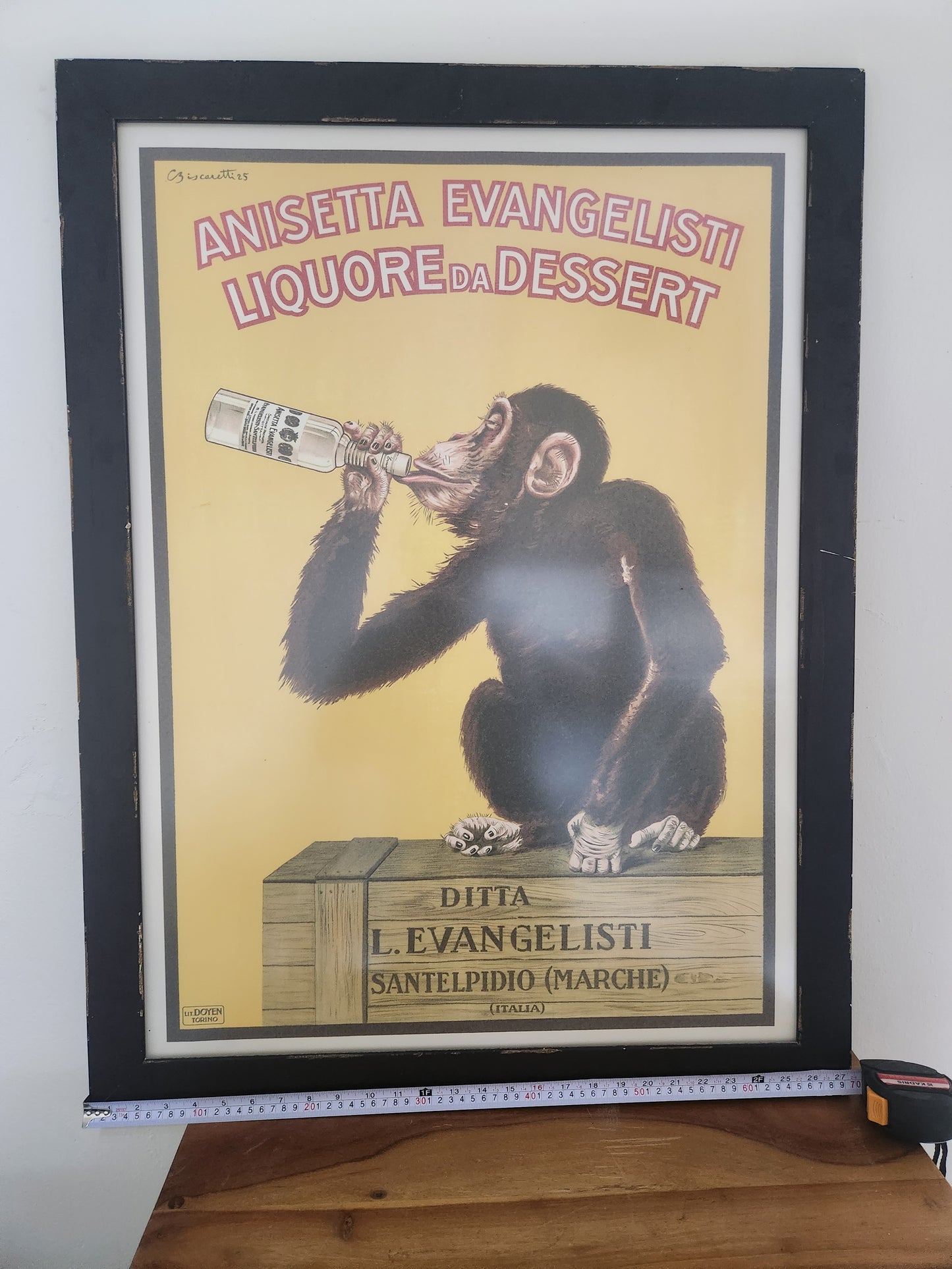 Full view of the framed Anisetta Evangelisti poster in its black wood frame, approx. 88 x 66 cm